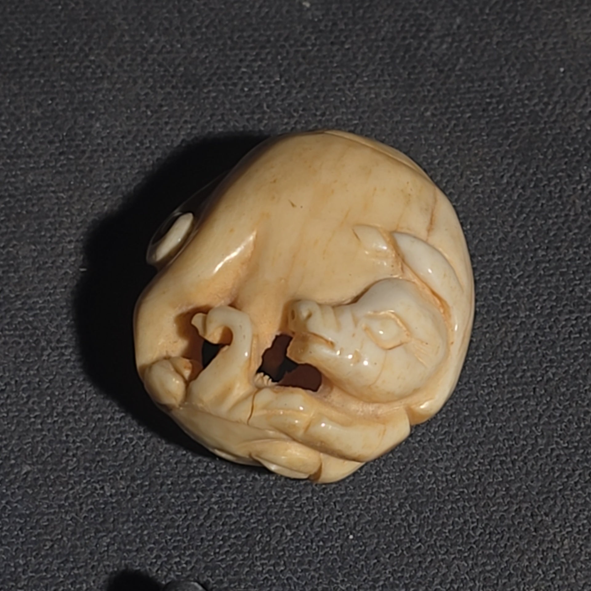 Grouping of Vintage and Modern Smalls including Carved Wood Figure, Carved Netsuke-Style Figure, U.S.M.C. Pin, United States Army Dog Tag Pendant, and Miniature Padlock