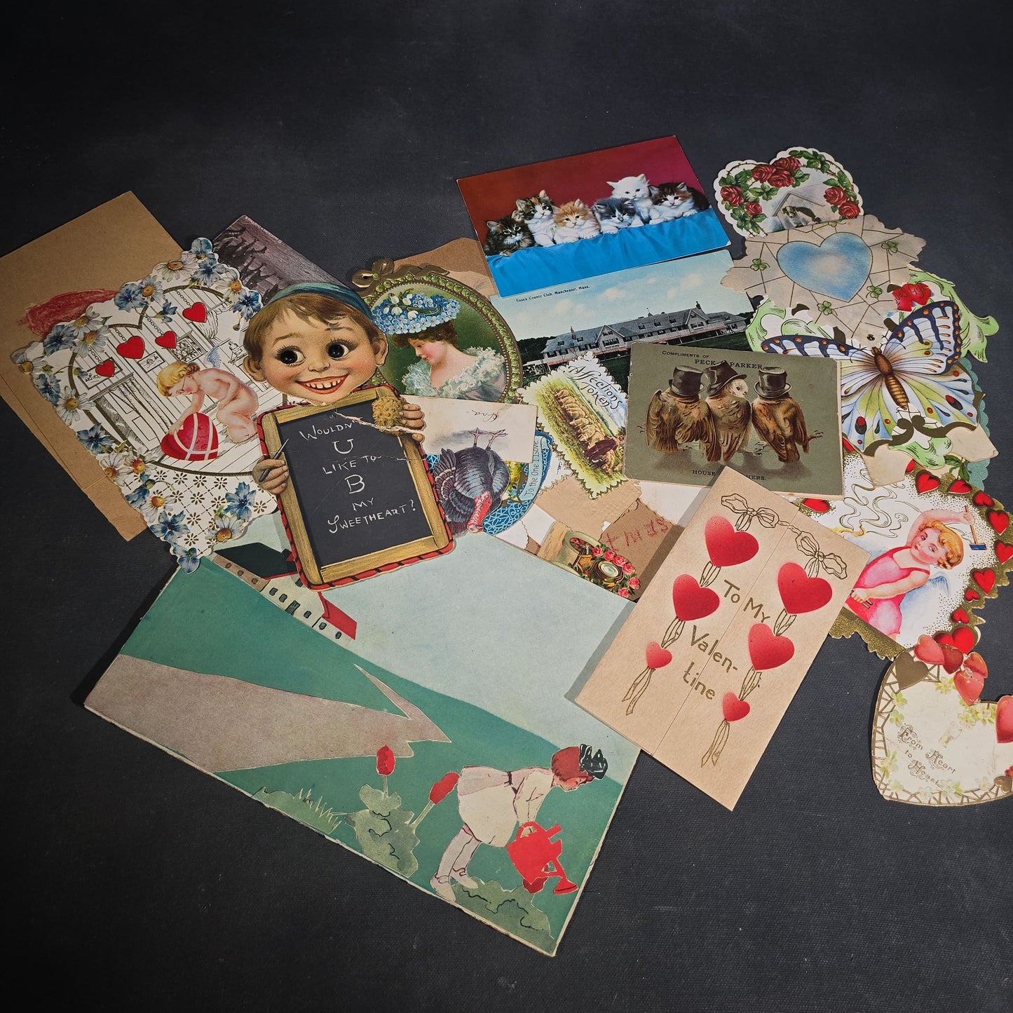 Grouping of 25+ Antique and Vintage Valentines, Postcards, Trade Cards, and Die-Cut Ephemera including Mechanical Chalkboard Valentine, Peck & Parker Owls Trade Card, and Essex County Club Manchester, Massachusetts Postcard