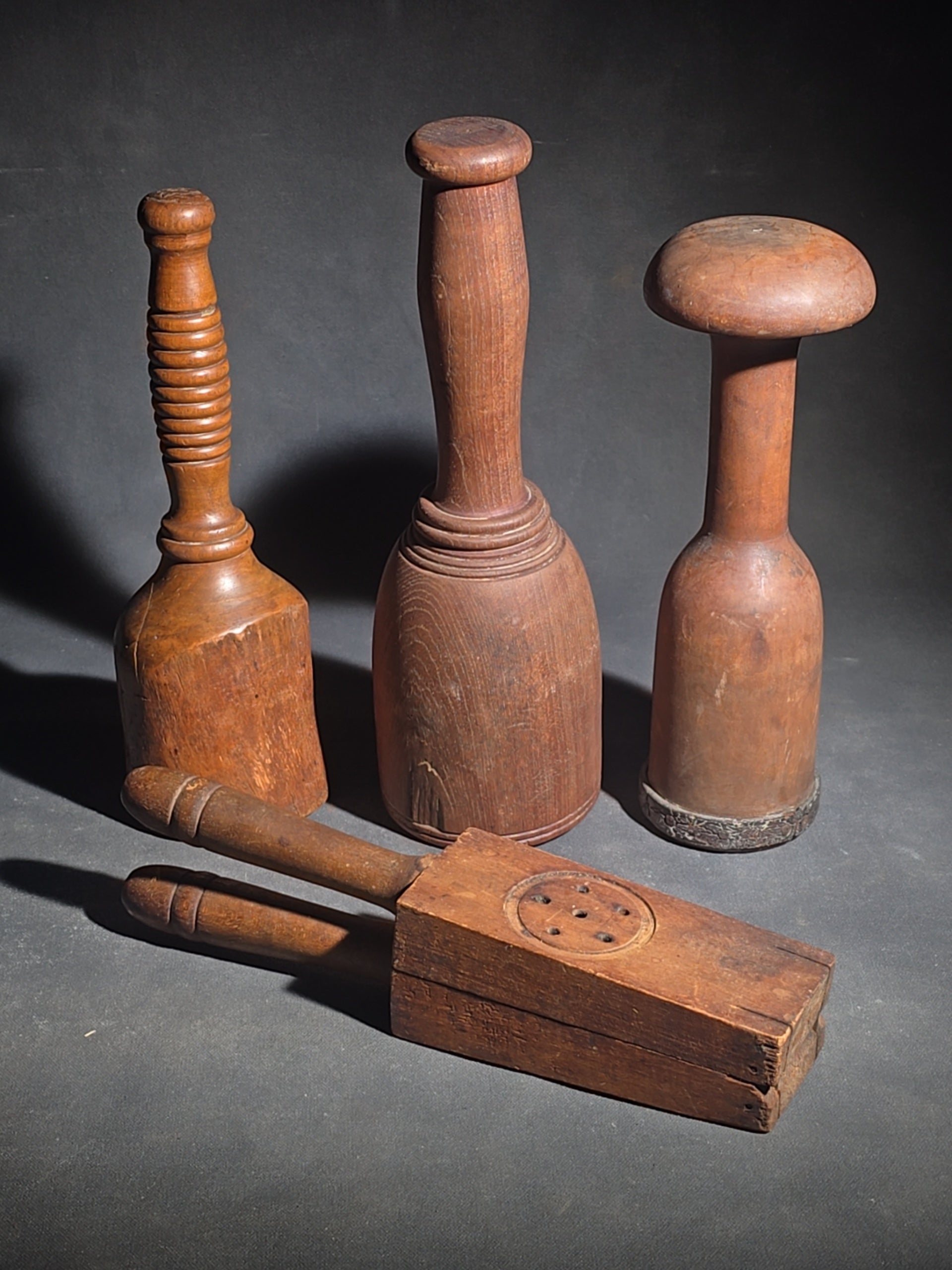 Grouping of Four Antique Wooden Kitchen Tools including Three Turned Mashers and a Handled Reamer