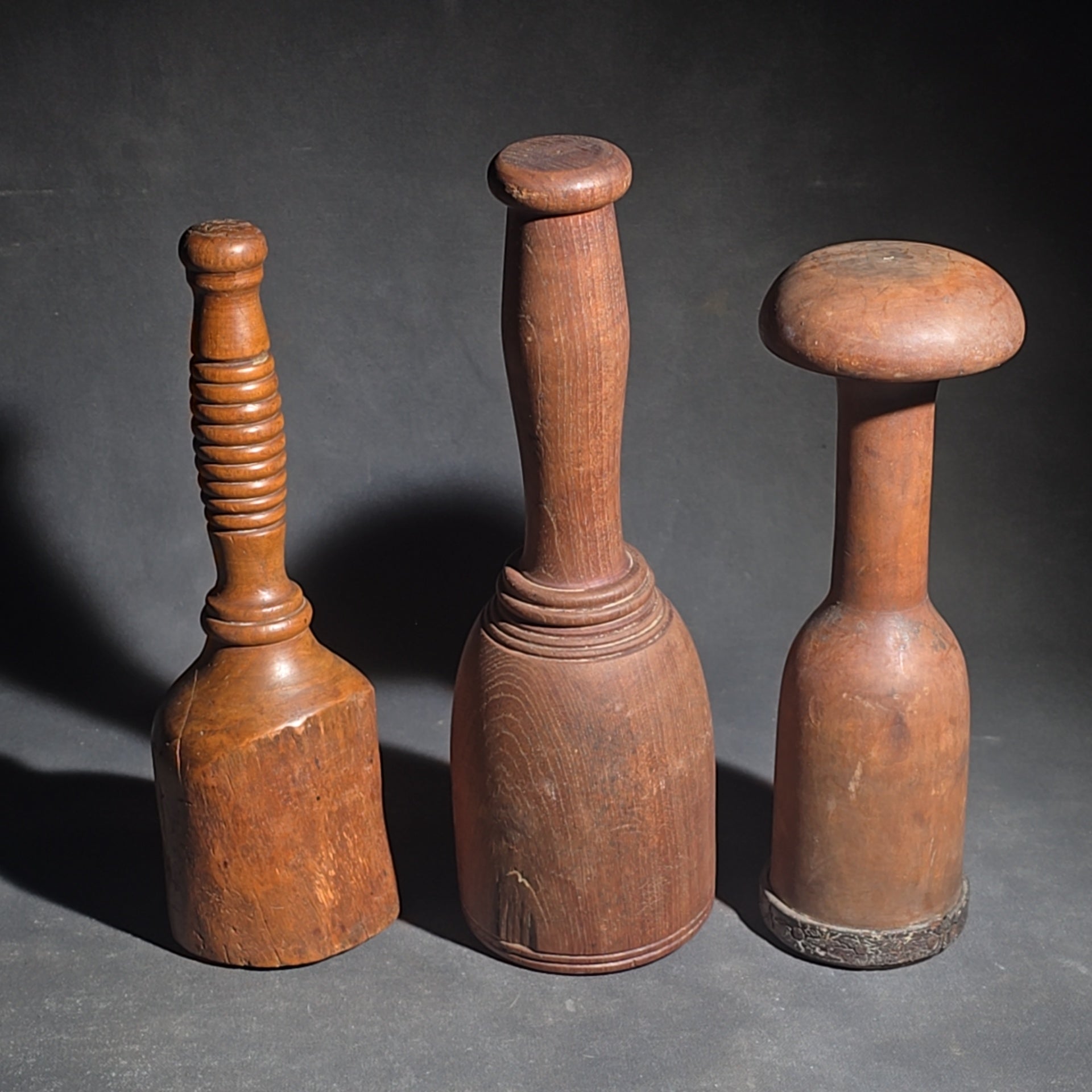 Grouping of Four Antique Wooden Kitchen Tools including Three Turned Mashers and a Handled Reamer