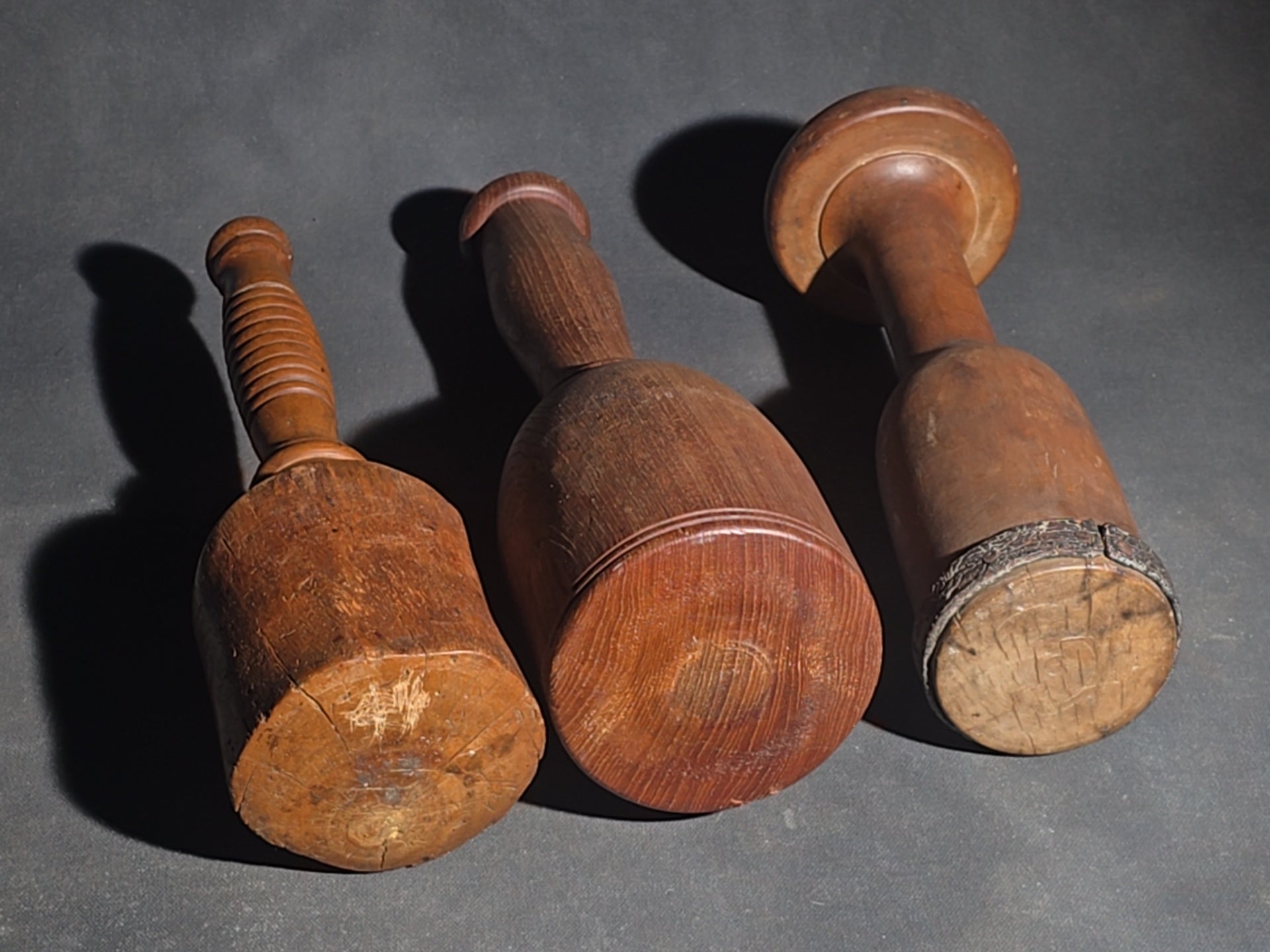 Grouping of Four Antique Wooden Kitchen Tools including Three Turned Mashers and a Handled Reamer