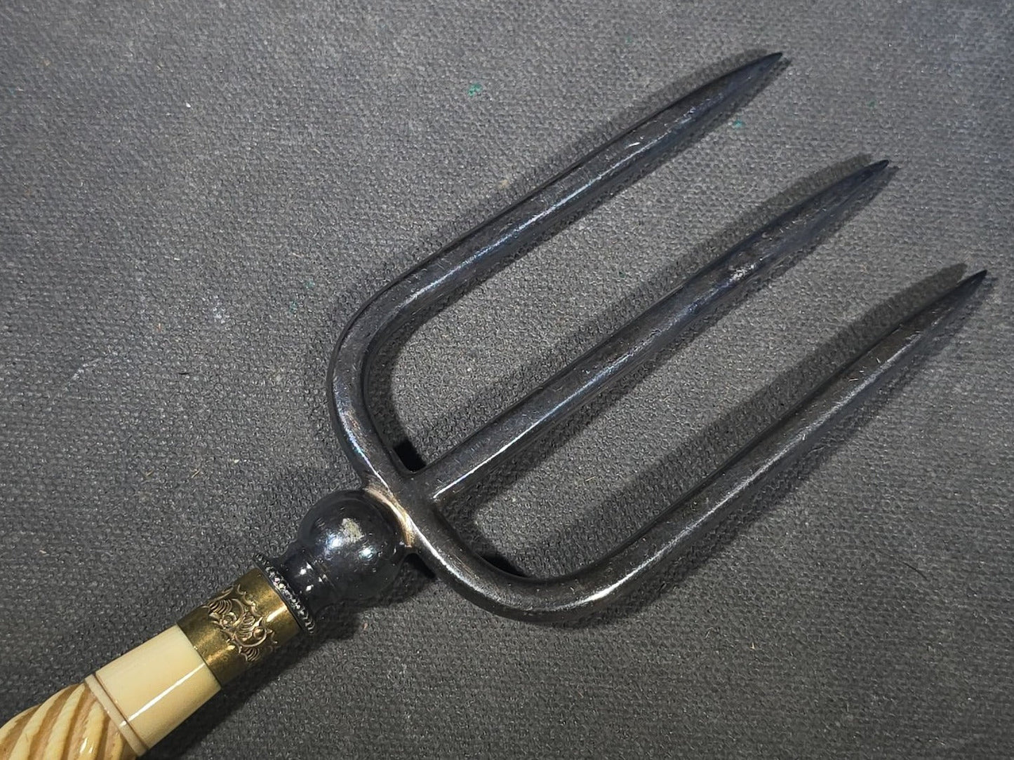 Antique Four-Tine Bread Fork with Carved Bone Handle and Brass Ferrules