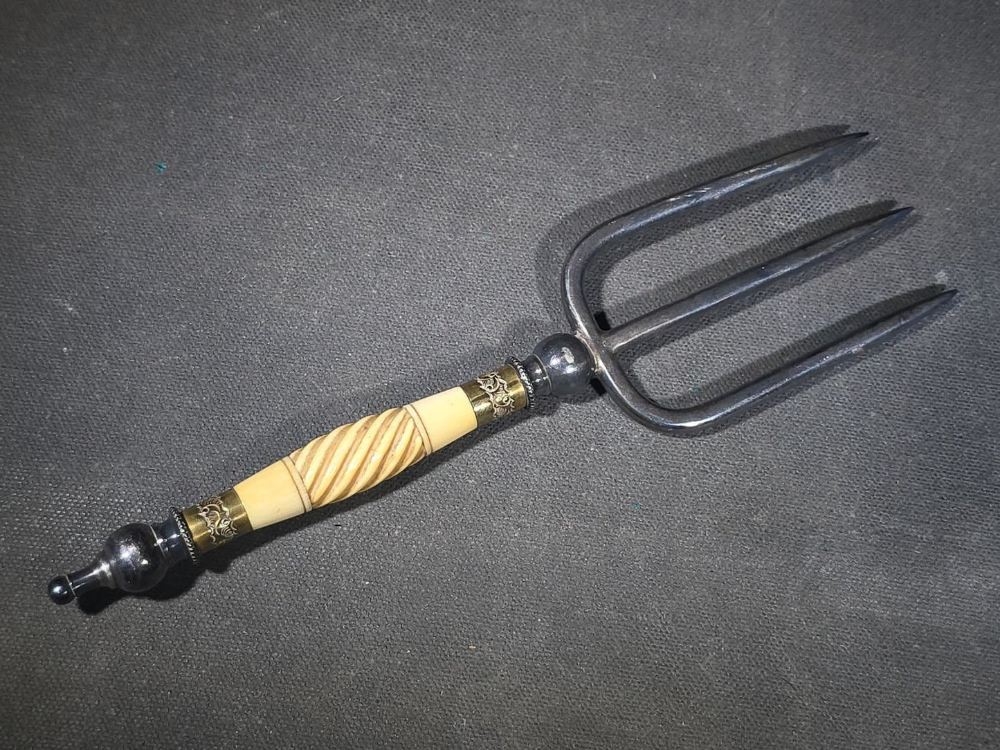 Antique Four-Tine Bread Fork with Carved Bone Handle and Brass Ferrules
