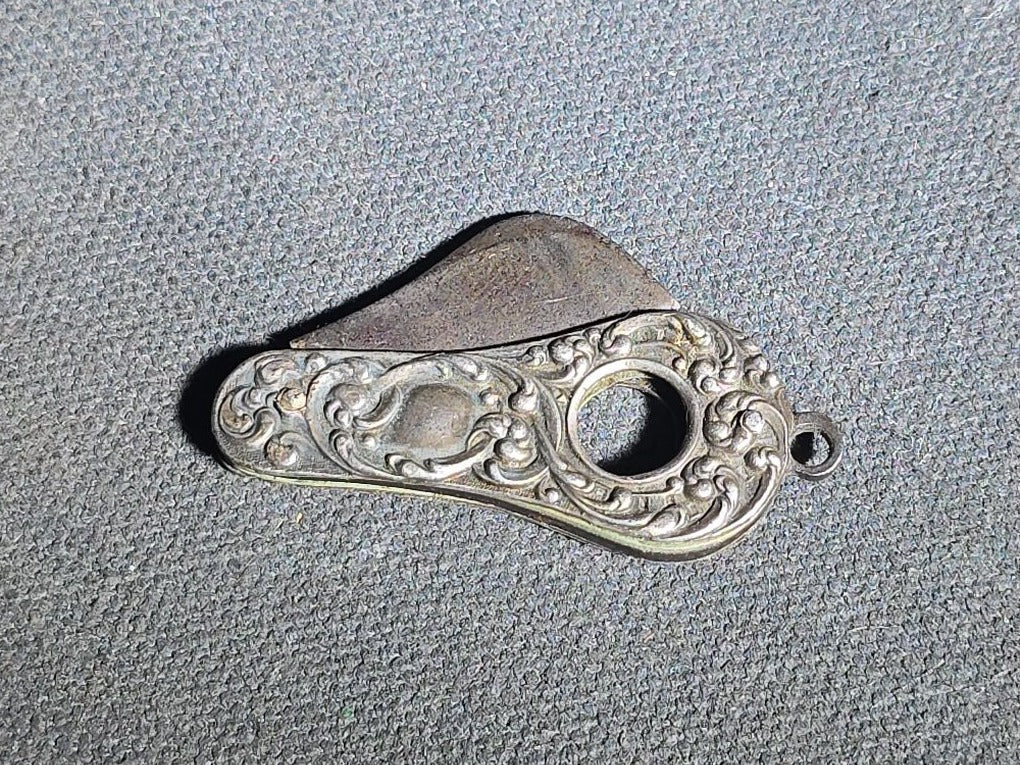 Antique Sterling Silver Cigar Cutter with Repousse Scroll Decoration