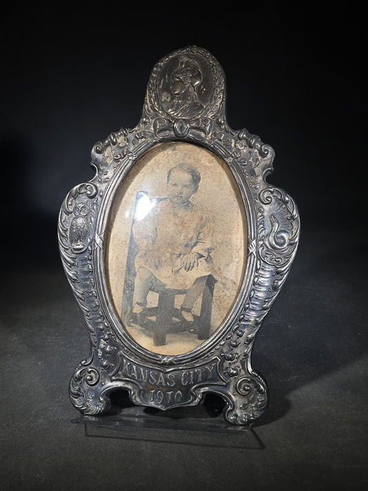 Antique Commemorative Souvenir Picture Frame Marked "Kansas City 1910" with Oval Convex Glass and Photograph of a Seated Child, Owl and Serpent Motif