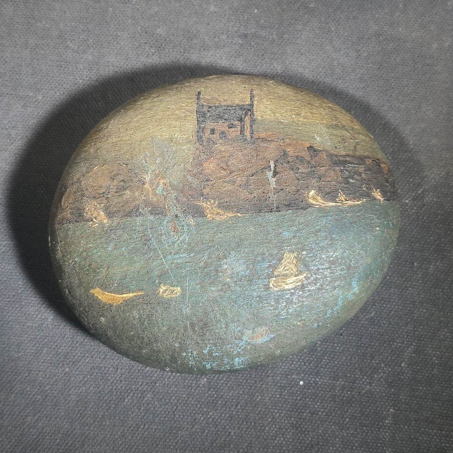 Antique Hand-Painted Stone with Coastal Scene Depicting a Church on Rocky Shoreline with Sailboats