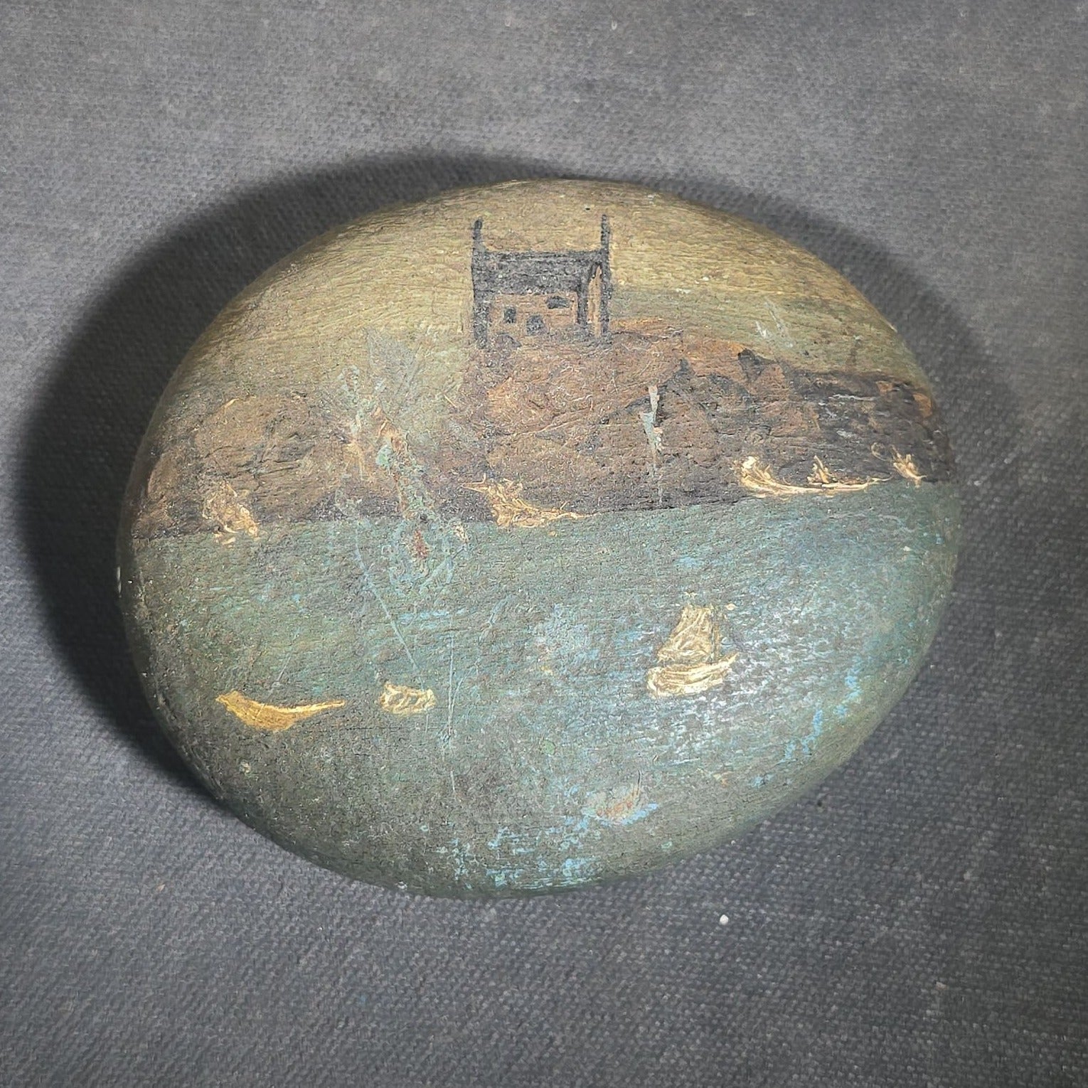 Antique Hand-Painted Stone with Coastal Scene Depicting a Church on Rocky Shoreline with Sailboats
