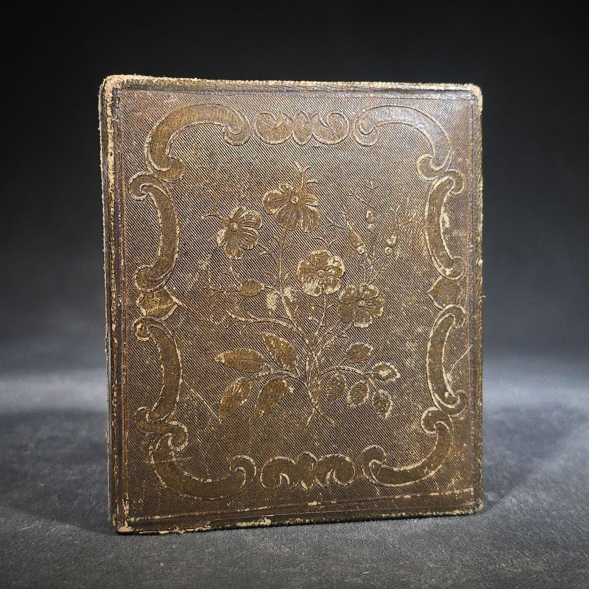 Antique 1/6th Plate Daguerreotype Photograph of a Child Standing Beside a Cloth-Covered Table with a Cap in Full Intact Leatherette Union Case with Embossed Floral and Scroll Design