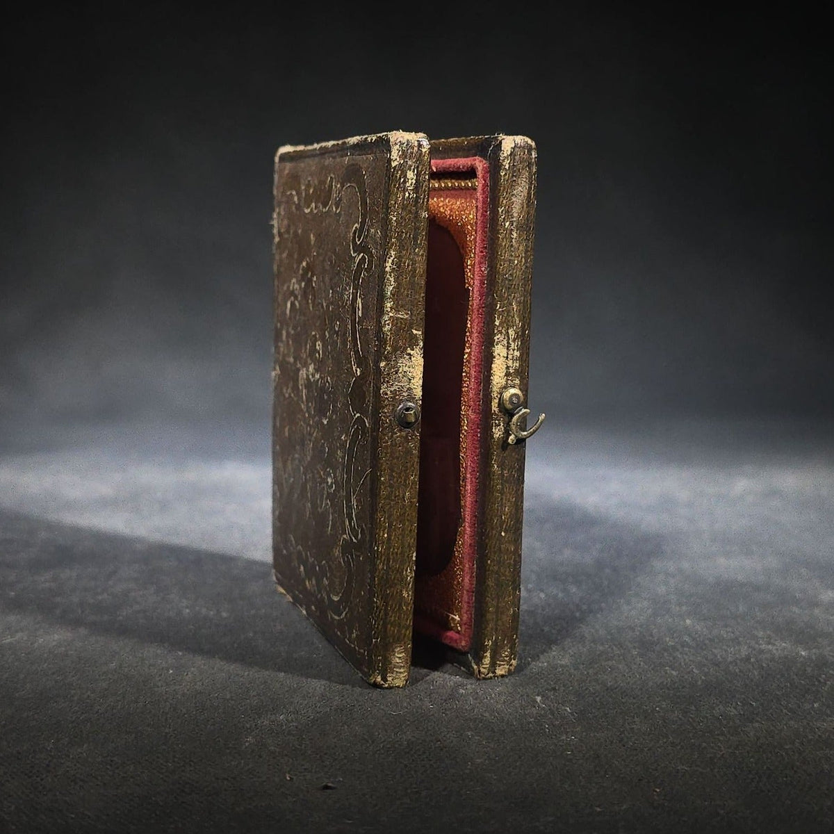 Antique 1/6th Plate Daguerreotype Photograph of a Child Standing Beside a Cloth-Covered Table with a Cap in Full Intact Leatherette Union Case with Embossed Floral and Scroll Design