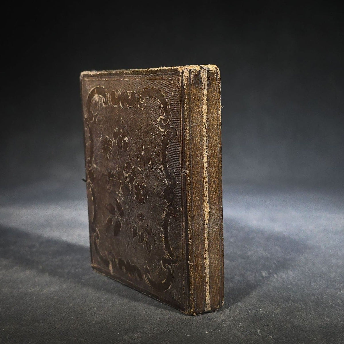 Antique 1/6th Plate Daguerreotype Photograph of a Child Standing Beside a Cloth-Covered Table with a Cap in Full Intact Leatherette Union Case with Embossed Floral and Scroll Design