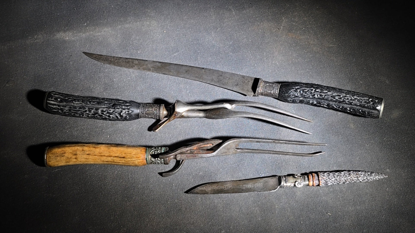 Grouping of Four Antique Carving Pieces including Trans-Mississippi Exposition Omaha 1898 Souvenir Knife, Stag-Handle Carving Knife and Fork, and Wood-Handle Carving Fork