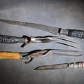 Lot 160 - Grouping of Four Antique Carving Pieces Including Trans-Mississippi Exposition Omaha 1898 Souvenir Knife, Stag-Handle Carving Knife and Fork, and Wood-Handle Carving Fork