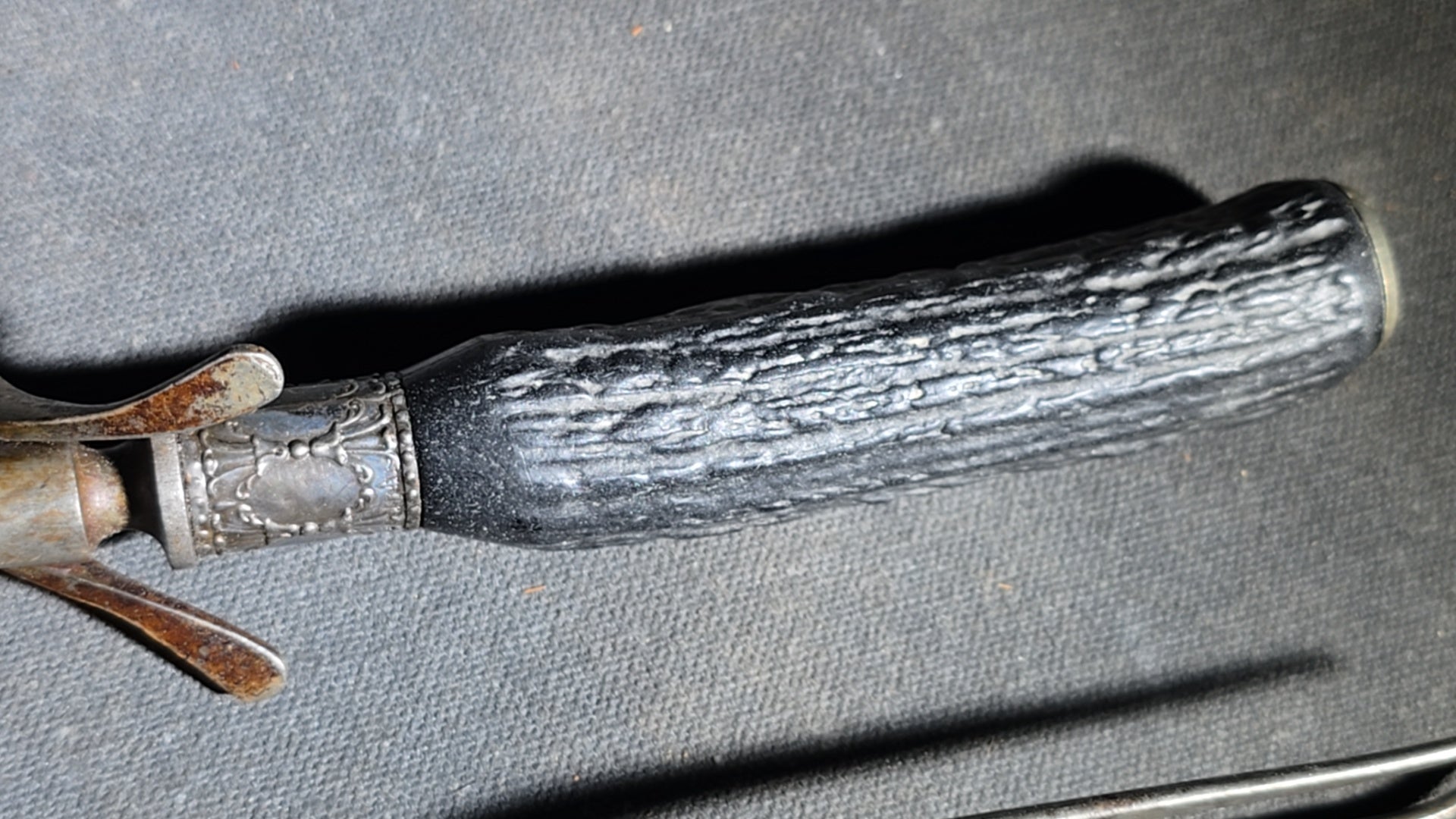 Grouping of Four Antique Carving Pieces including Trans-Mississippi Exposition Omaha 1898 Souvenir Knife, Stag-Handle Carving Knife and Fork, and Wood-Handle Carving Fork