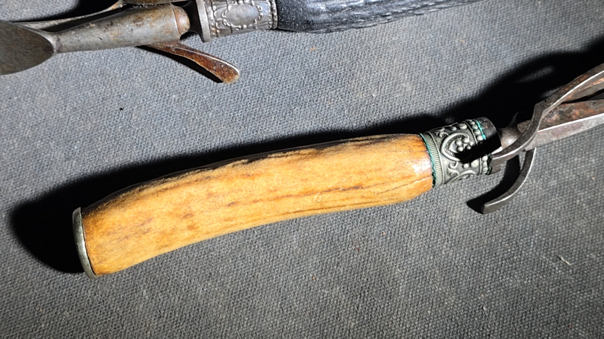 Grouping of Four Antique Carving Pieces including Trans-Mississippi Exposition Omaha 1898 Souvenir Knife, Stag-Handle Carving Knife and Fork, and Wood-Handle Carving Fork