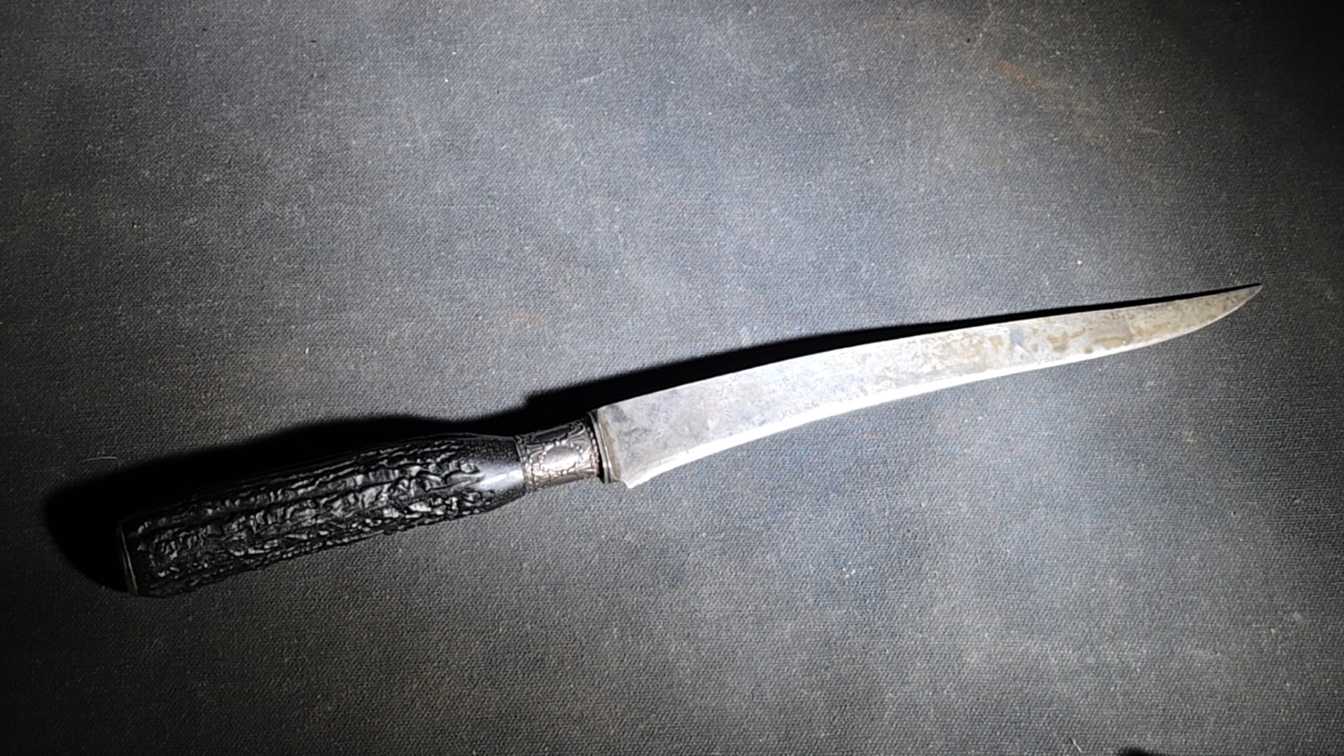 Grouping of Four Antique Carving Pieces including Trans-Mississippi Exposition Omaha 1898 Souvenir Knife, Stag-Handle Carving Knife and Fork, and Wood-Handle Carving Fork
