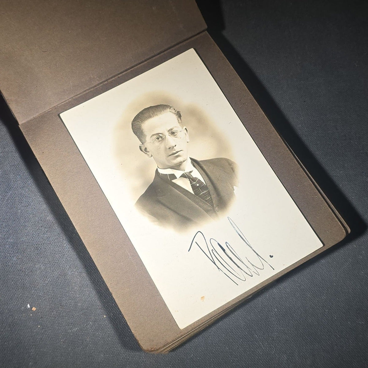 Antique Snapshot Photo Album Containing 45+ Snapshot Photographs, German-Captioned Transatlantic Voyage Aboard the R.M.S. Majestic with New York City Street Scenes, Shipboard Costume Party, Dining Room Interior, and Portraits