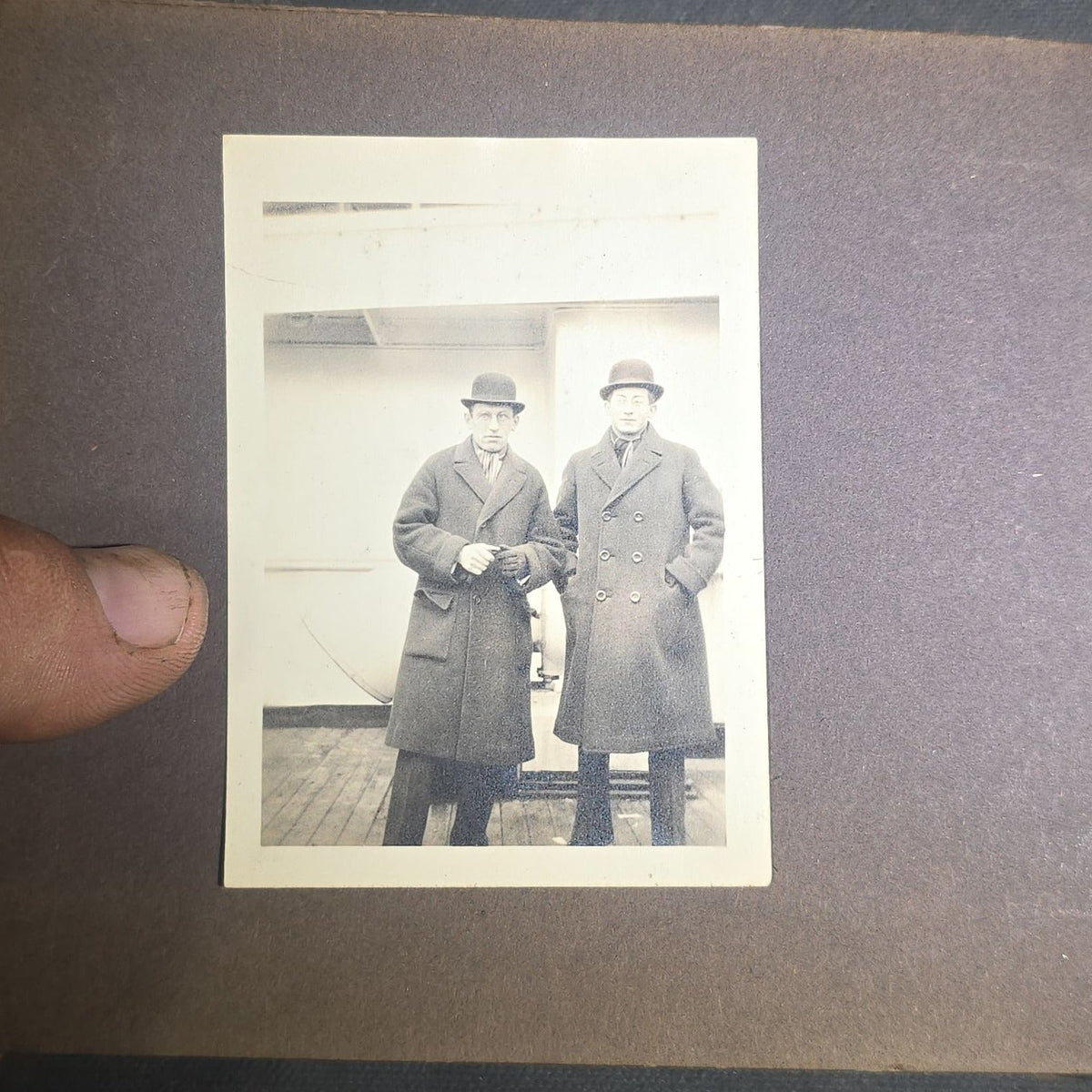 Antique Snapshot Photo Album Containing 45+ Snapshot Photographs, German-Captioned Transatlantic Voyage Aboard the R.M.S. Majestic with New York City Street Scenes, Shipboard Costume Party, Dining Room Interior, and Portraits