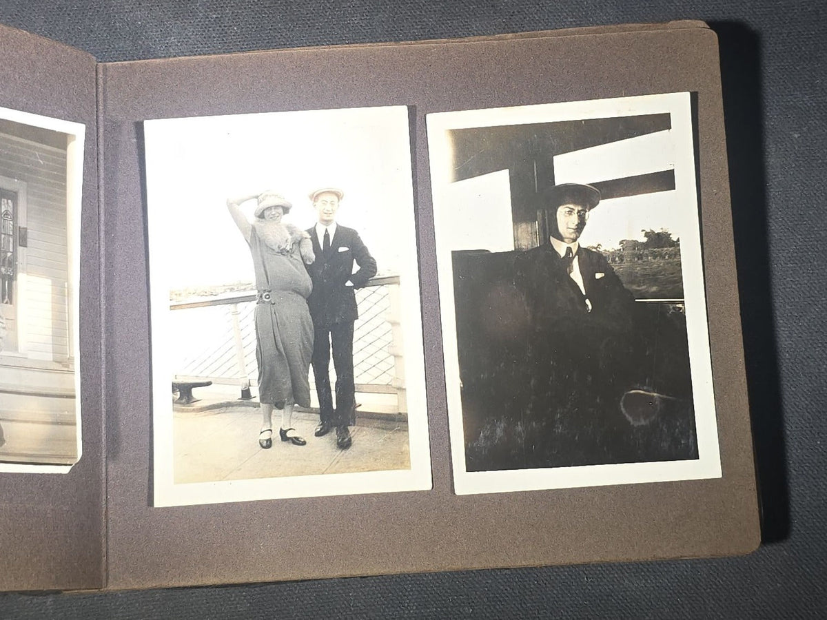 Antique Snapshot Photo Album Containing 45+ Snapshot Photographs, German-Captioned Transatlantic Voyage Aboard the R.M.S. Majestic with New York City Street Scenes, Shipboard Costume Party, Dining Room Interior, and Portraits