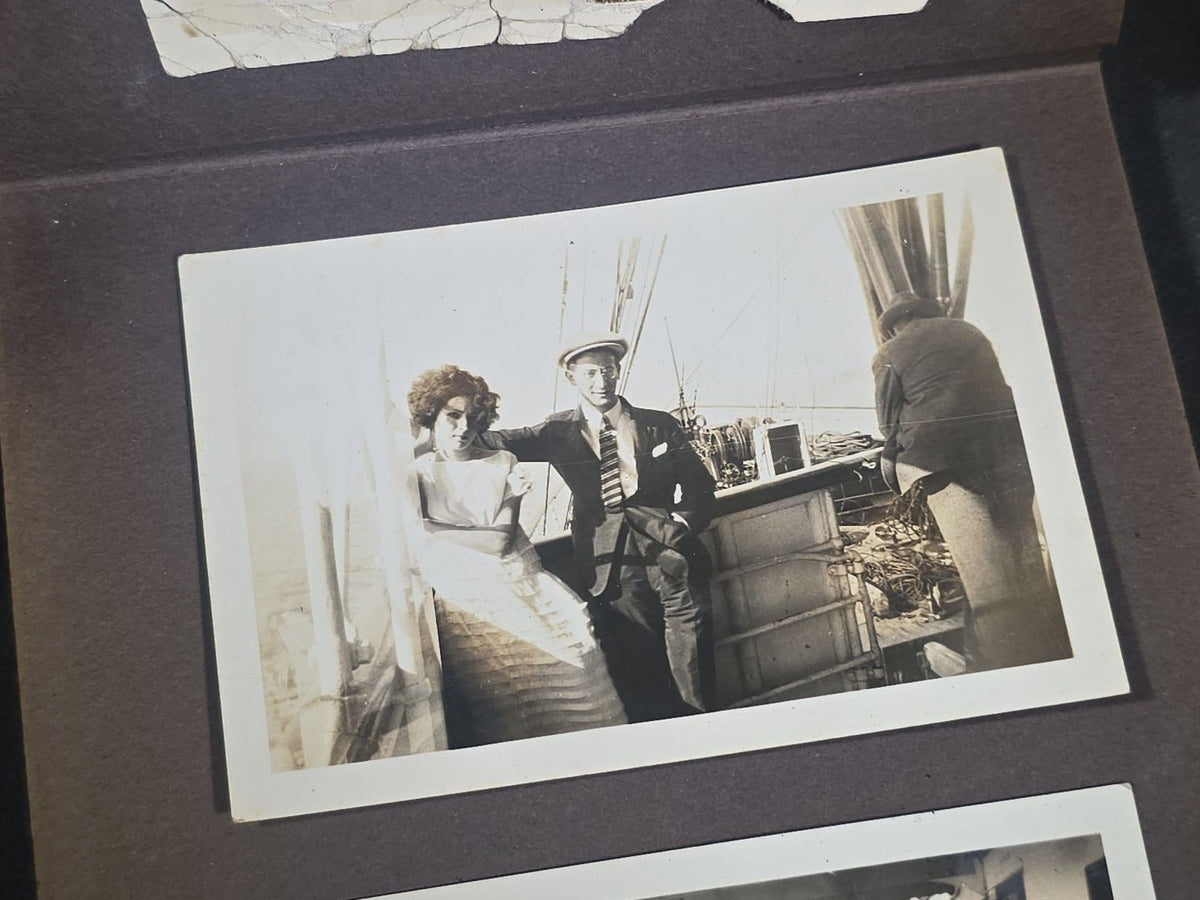 Antique Snapshot Photo Album Containing 45+ Snapshot Photographs, German-Captioned Transatlantic Voyage Aboard the R.M.S. Majestic with New York City Street Scenes, Shipboard Costume Party, Dining Room Interior, and Portraits