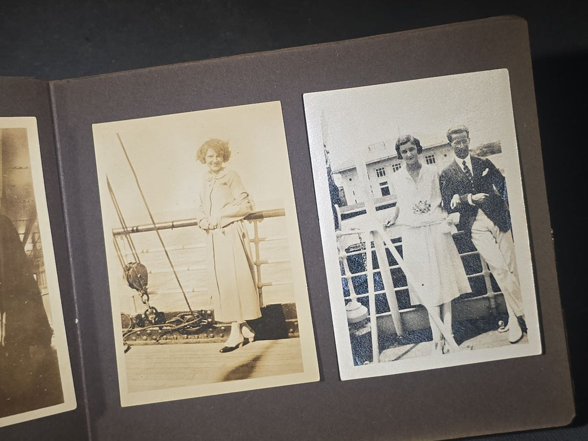 Antique Snapshot Photo Album Containing 45+ Snapshot Photographs, German-Captioned Transatlantic Voyage Aboard the R.M.S. Majestic with New York City Street Scenes, Shipboard Costume Party, Dining Room Interior, and Portraits
