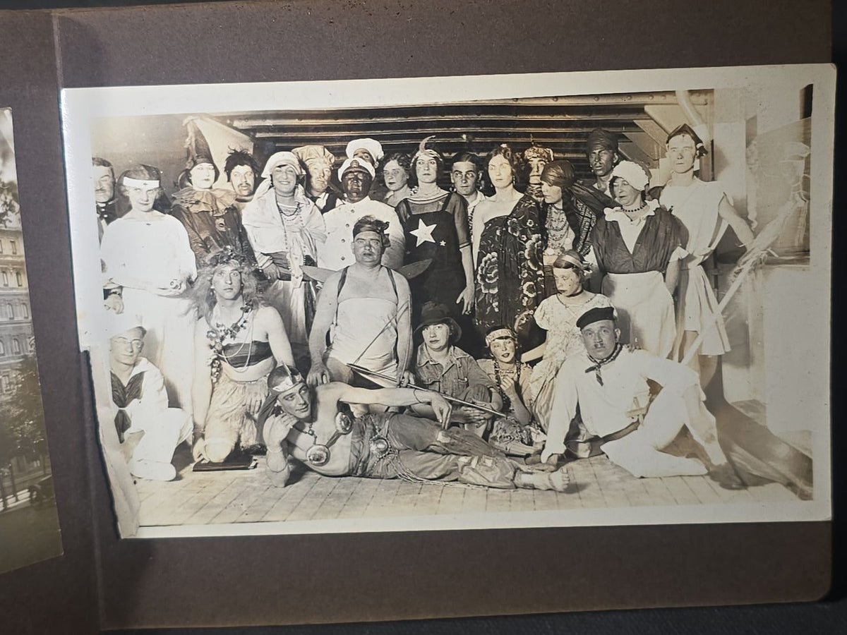 Antique Snapshot Photo Album Containing 45+ Snapshot Photographs, German-Captioned Transatlantic Voyage Aboard the R.M.S. Majestic with New York City Street Scenes, Shipboard Costume Party, Dining Room Interior, and Portraits