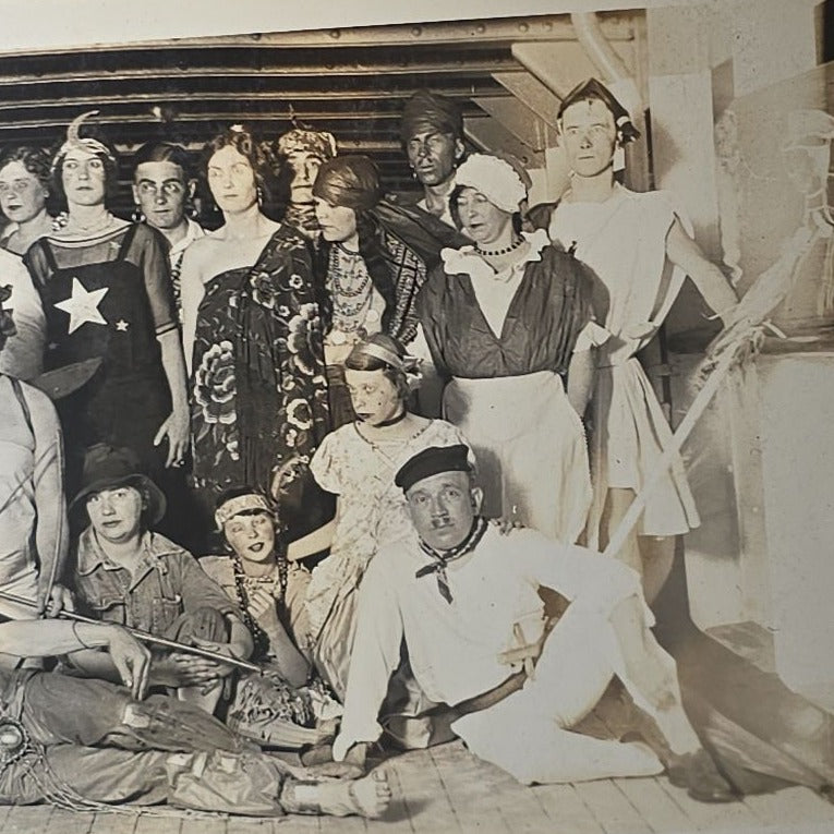 Antique Snapshot Photo Album Containing 45+ Snapshot Photographs, German-Captioned Transatlantic Voyage Aboard the R.M.S. Majestic with New York City Street Scenes, Shipboard Costume Party, Dining Room Interior, and Portraits