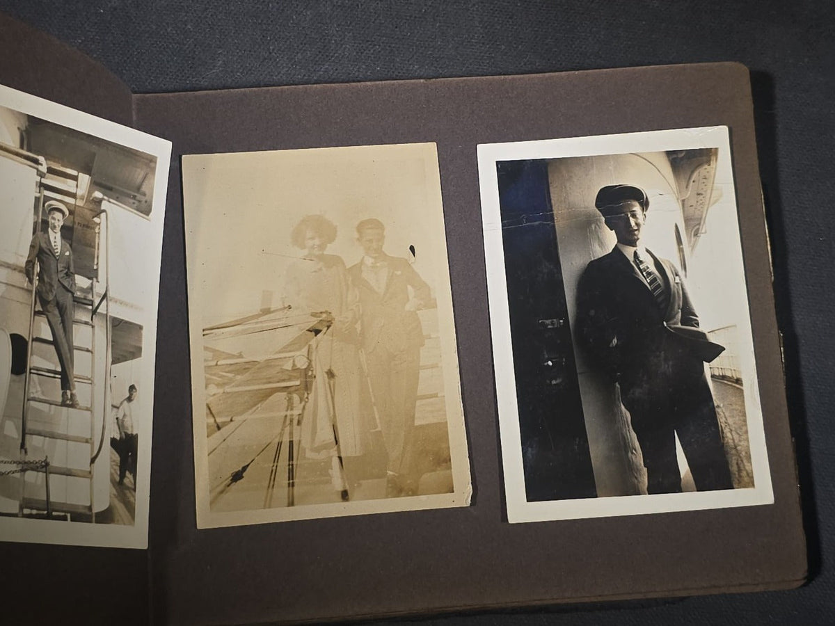 Antique Snapshot Photo Album Containing 45+ Snapshot Photographs, German-Captioned Transatlantic Voyage Aboard the R.M.S. Majestic with New York City Street Scenes, Shipboard Costume Party, Dining Room Interior, and Portraits
