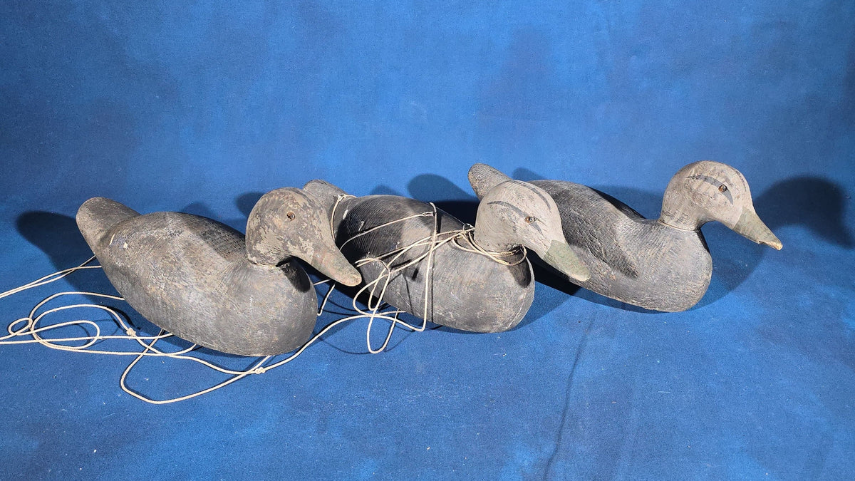 Trio of Antique Hand-Carved and Hand-Painted Wooden Duck Decoys with Glass Eyes and Rigging Lines