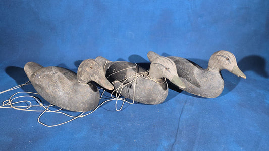 Trio of Antique Hand-Carved and Hand-Painted Wooden Duck Decoys with Glass Eyes and Rigging Lines