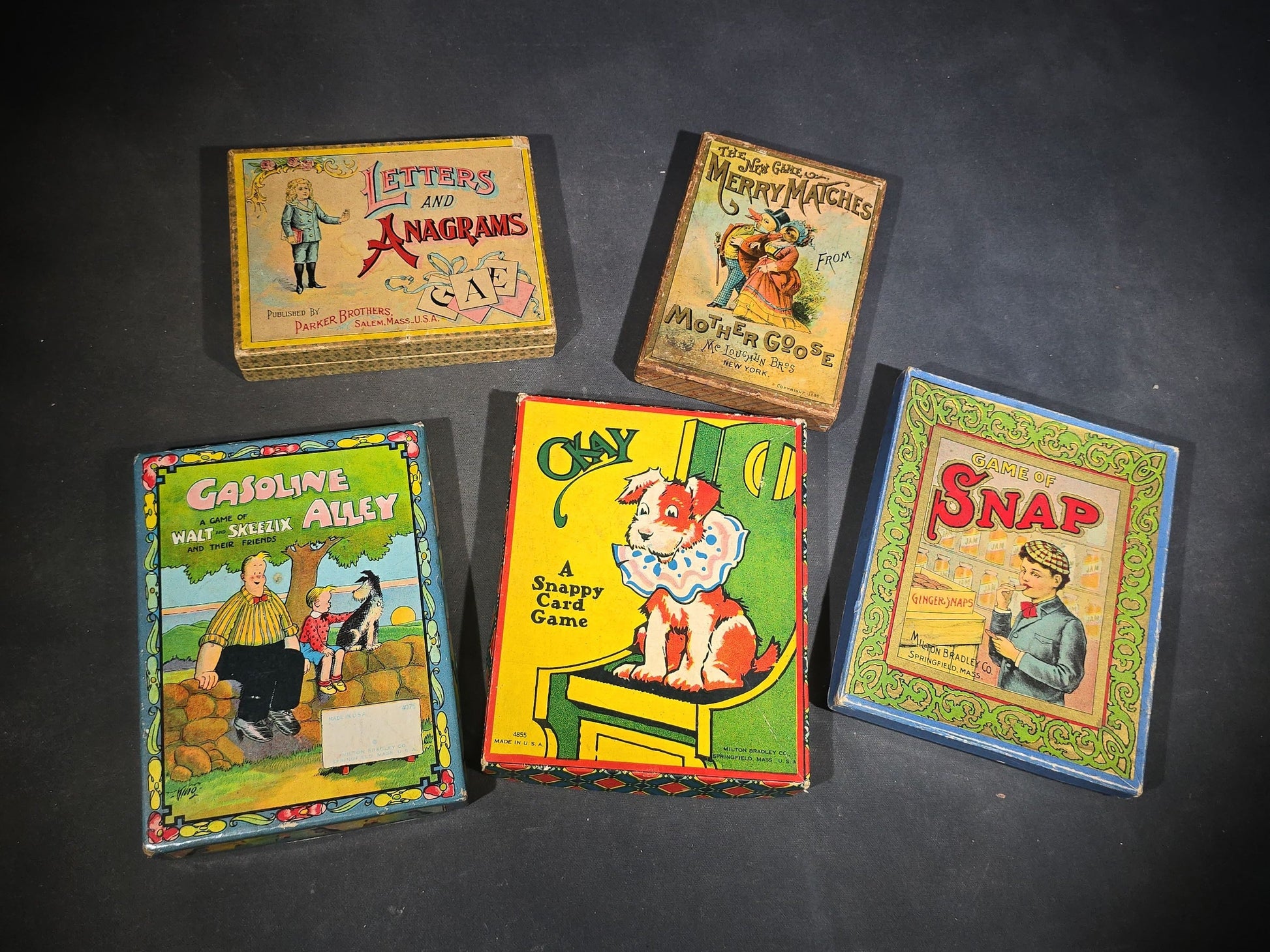 Grouping of Five Antique Card and Letter Games including Okay, Gasoline Alley, Letters and Anagrams, Merry Matches, and Snap, Published by Milton Bradley, Parker Brothers, and McLoughlin Bros.