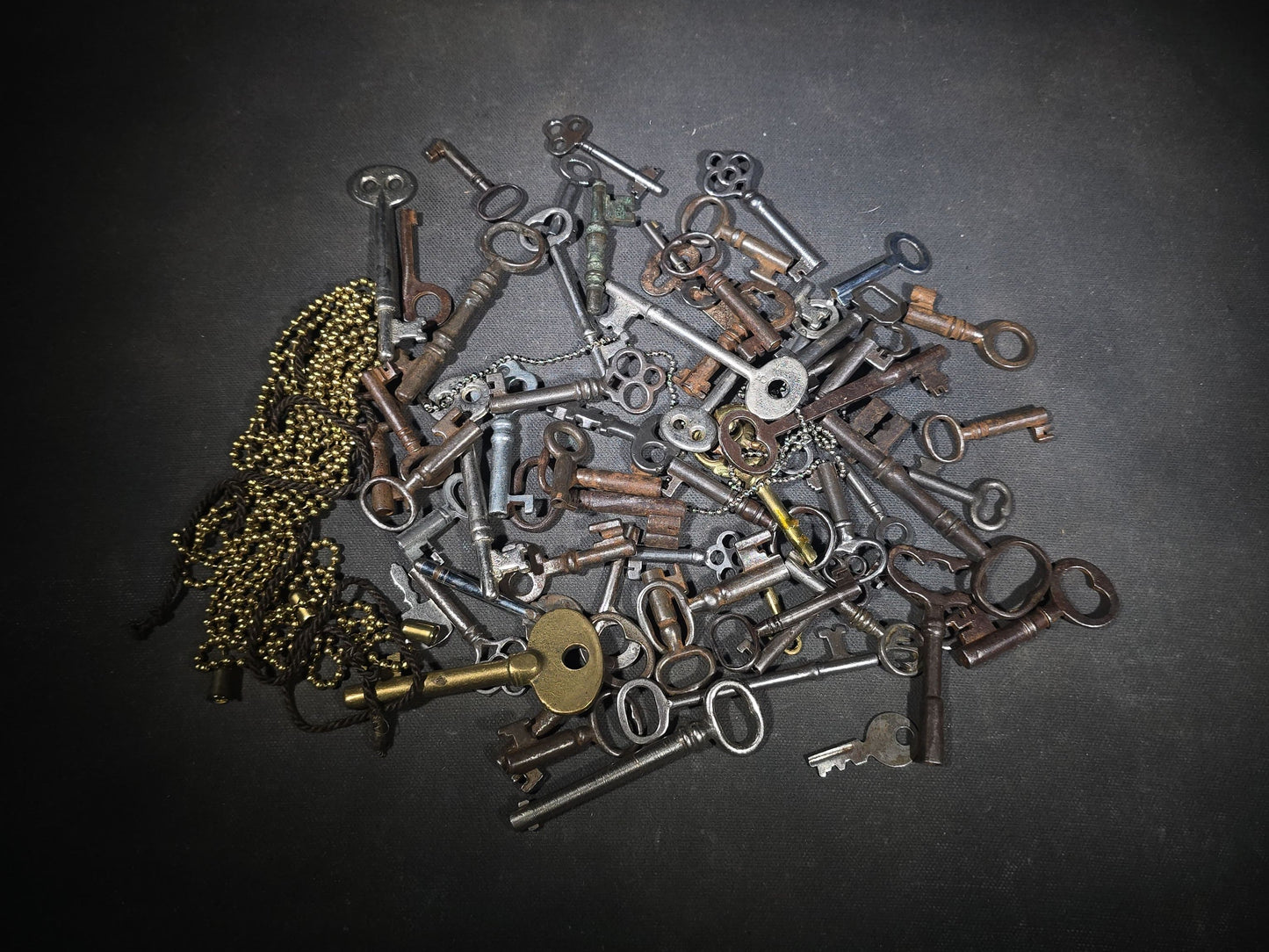 Grouping of 50+ Antique and Vintage Skeleton Keys including Barrel Keys, Cabinet Keys, and Padlock Keys