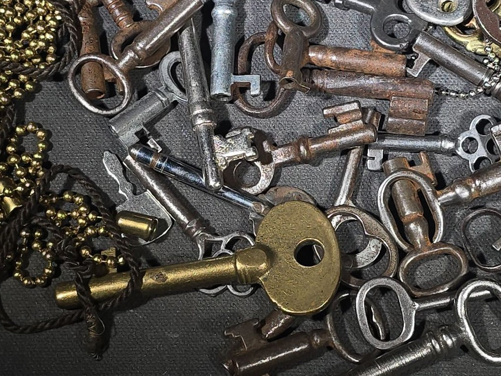 Grouping of 50+ Antique and Vintage Skeleton Keys including Barrel Keys, Cabinet Keys, and Padlock Keys