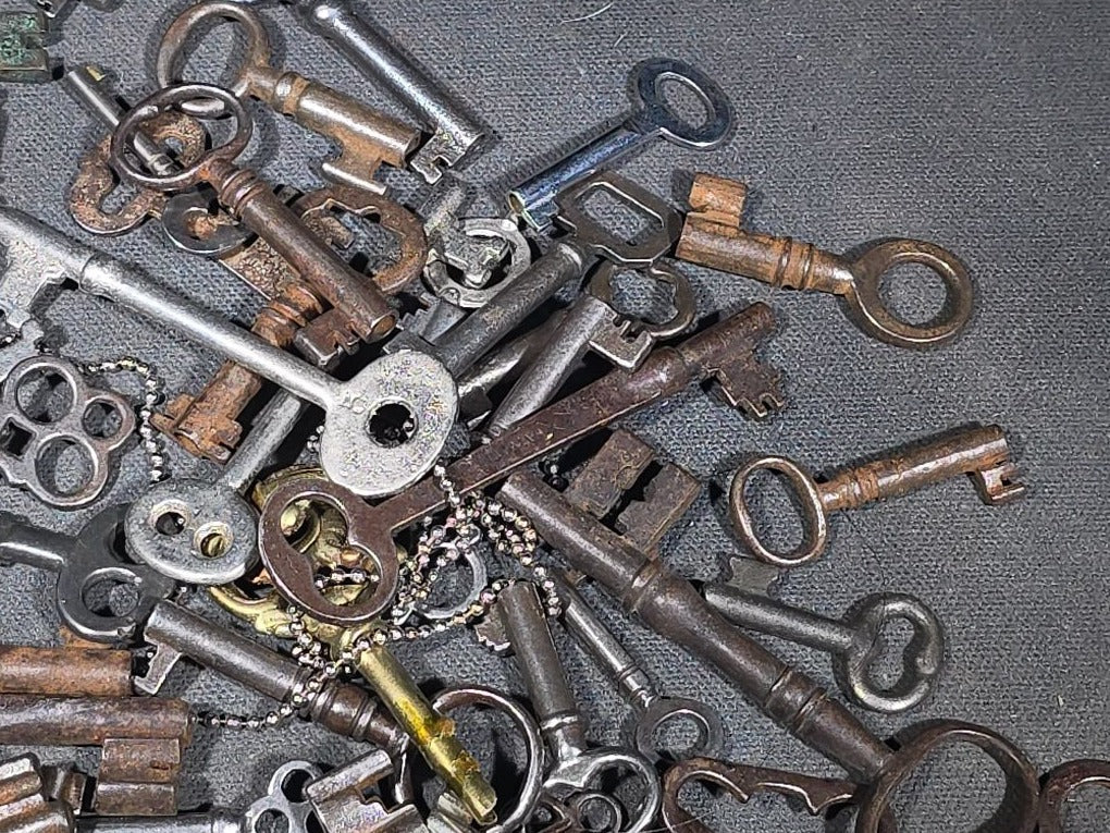 Grouping of 50+ Antique and Vintage Skeleton Keys including Barrel Keys, Cabinet Keys, and Padlock Keys