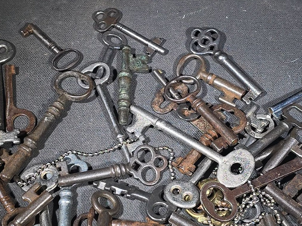 Grouping of 50+ Antique and Vintage Skeleton Keys including Barrel Keys, Cabinet Keys, and Padlock Keys