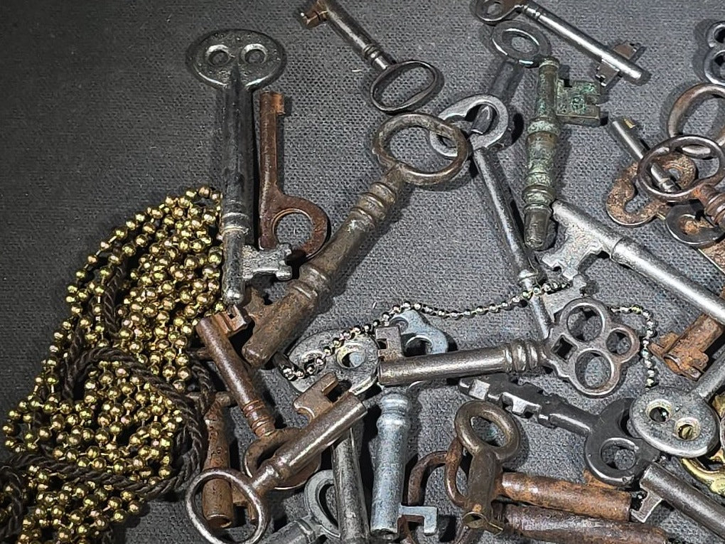 Grouping of 50+ Antique and Vintage Skeleton Keys including Barrel Keys, Cabinet Keys, and Padlock Keys