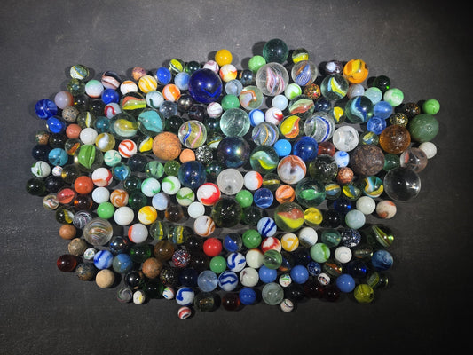 Grouping of 200+ Antique and Vintage Glass and Clay Marbles in Assorted Types and Sizes including Handmade German Swirls, Cat's Eyes, and UV-Fluorescent Examples