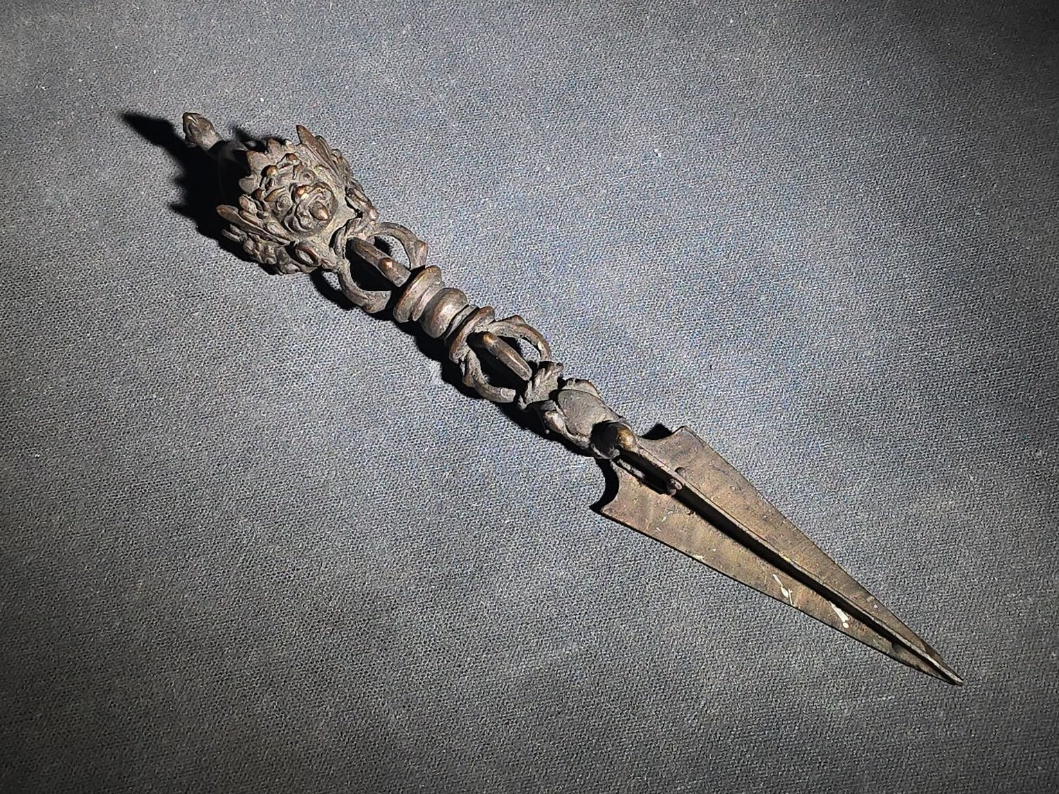 Antique Tibetan Bronze Phurba Ceremonial Ritual Dagger with Wrathful Deity Head and Triangular Blade