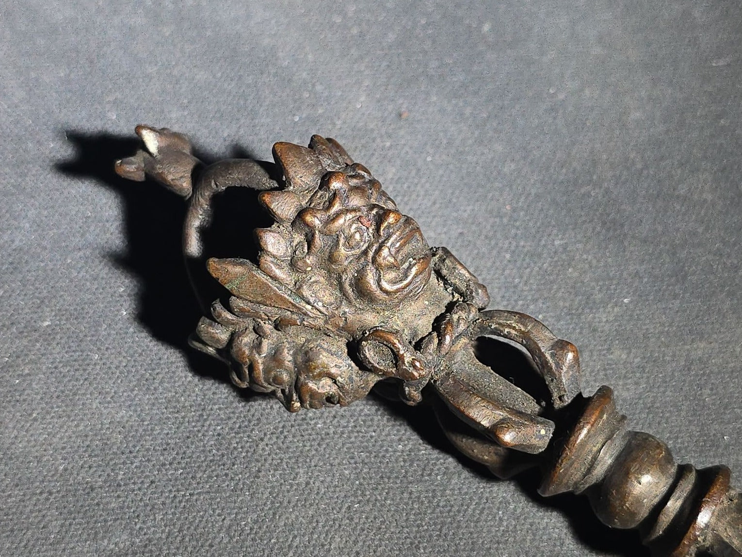 Antique Tibetan Bronze Phurba Ceremonial Ritual Dagger with Wrathful Deity Head and Triangular Blade