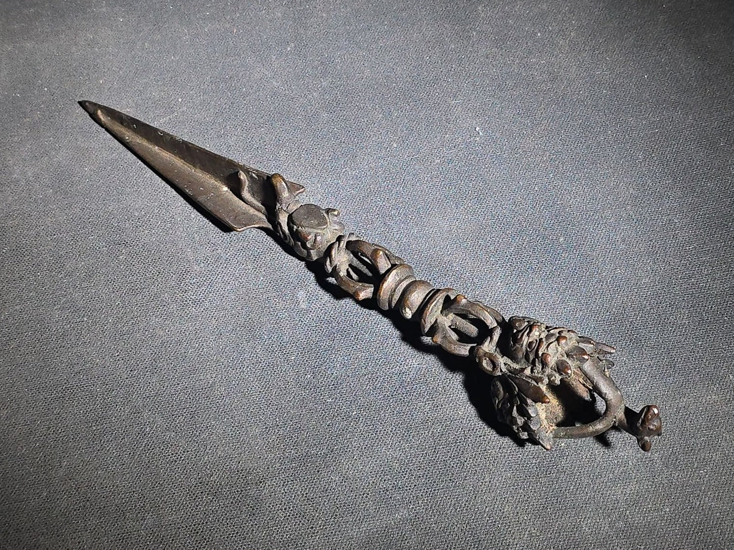 Antique Tibetan Bronze Phurba Ceremonial Ritual Dagger with Wrathful Deity Head and Triangular Blade
