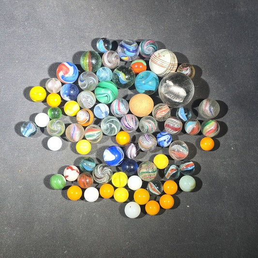 Grouping of 65+ Antique and Vintage Glass Marbles including Handmade German Swirls, Sulphide with Animal Figure, China, Clay, and UV-Reactive Glowing Examples