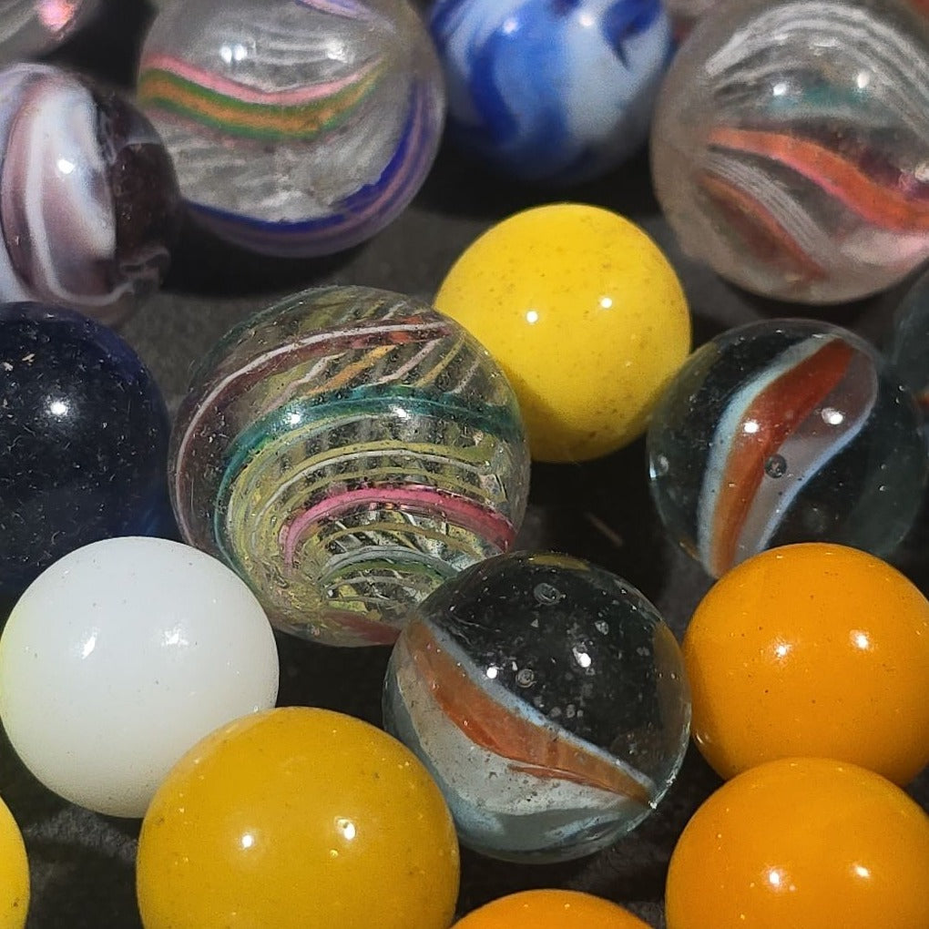 Grouping of 65+ Antique and Vintage Glass Marbles including Handmade German Swirls, Sulphide with Animal Figure, China, Clay, and UV-Reactive Glowing Examples