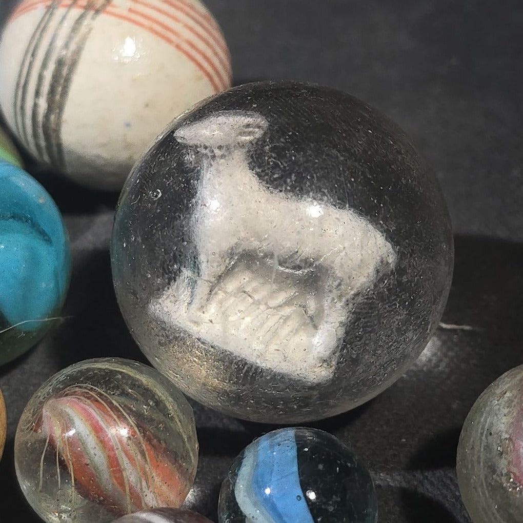 Grouping of 65+ Antique and Vintage Glass Marbles including Handmade German Swirls, Sulphide with Animal Figure, China, Clay, and UV-Reactive Glowing Examples
