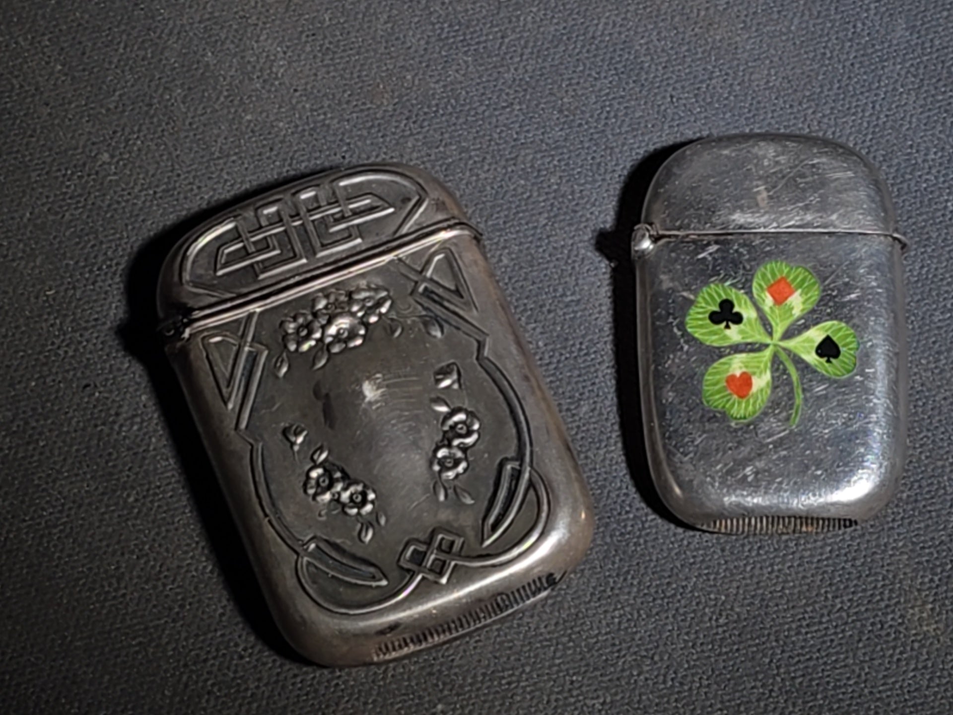 Pair of Antique Sterling Silver Match Safes including Art Nouveau Floral Example and Enameled Four-Leaf Clover with Card Suit Symbols