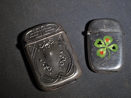 Pair of Antique Sterling Silver Match Safes including Art Nouveau Floral Example and Enameled Four-Leaf Clover with Card Suit Symbols