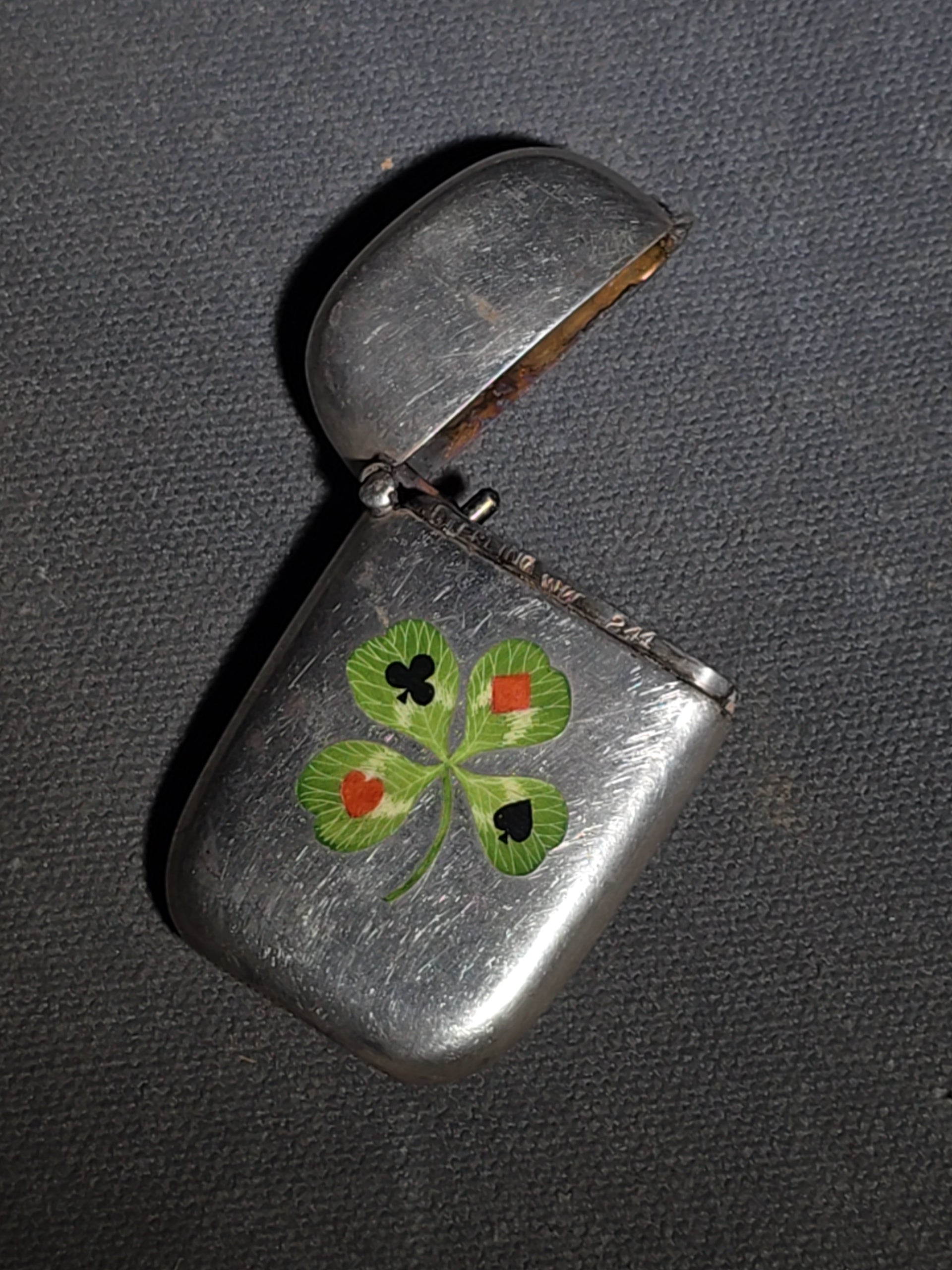 Pair of Antique Sterling Silver Match Safes including Art Nouveau Floral Example and Enameled Four-Leaf Clover with Card Suit Symbols