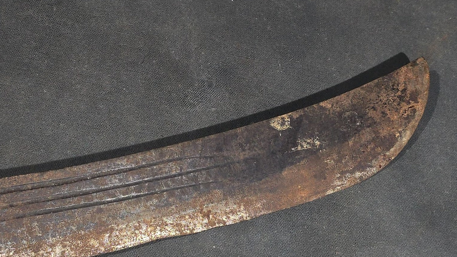 antique Machete with Curved Blade, Cord-Wrapped Handle, and Rounded Pommel
