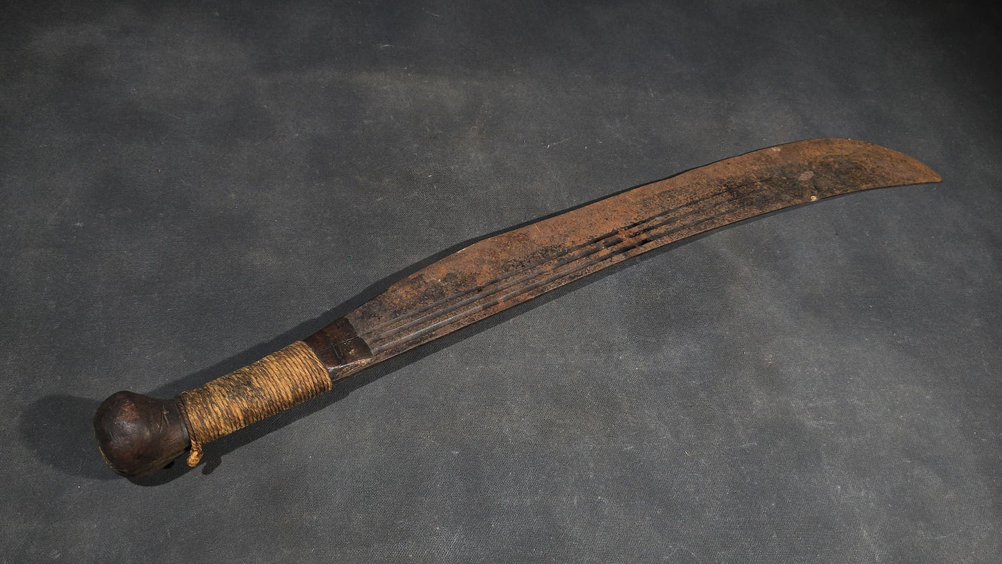 antique Machete with Curved Blade, Cord-Wrapped Handle, and Rounded Pommel