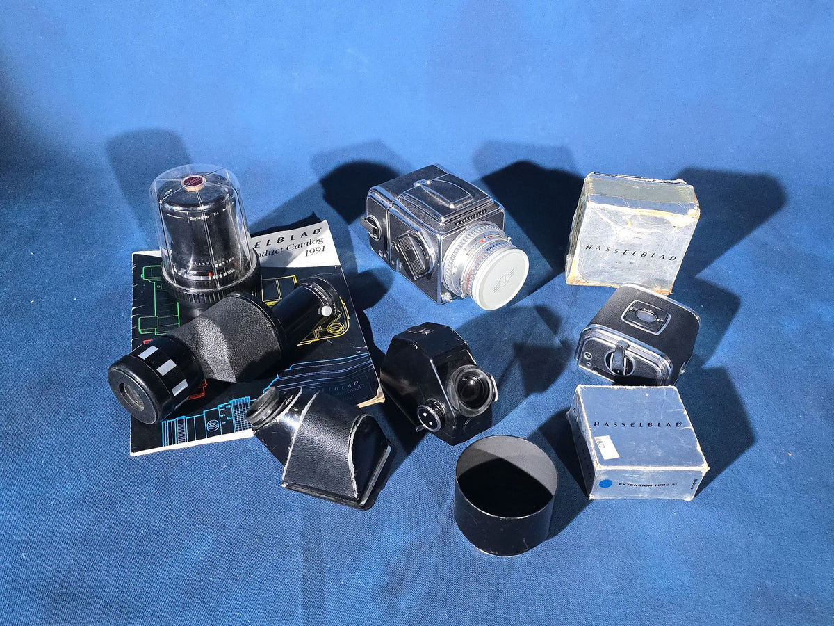 Vintage Hasselblad 500C/M Medium Format Camera with Carl Zeiss Planar 80mm and Distagon Lenses, Film Back, Prism Viewfinder, Extension Tube, and Accessories