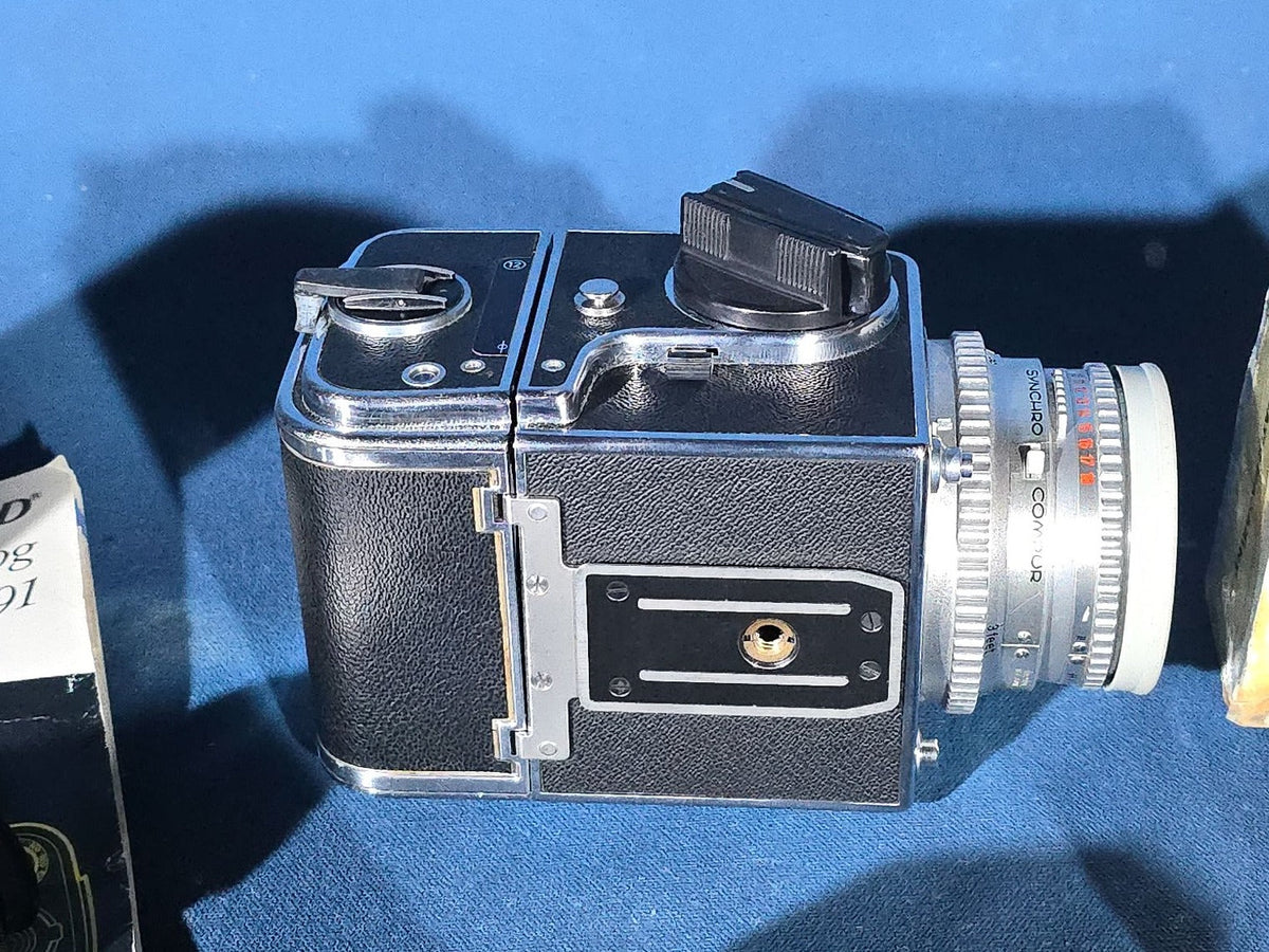 Vintage Hasselblad 500C/M Medium Format Camera with Carl Zeiss Planar 80mm and Distagon Lenses, Film Back, Prism Viewfinder, Extension Tube, and Accessories