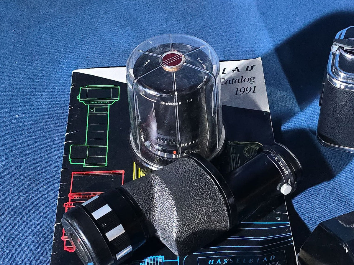 Vintage Hasselblad 500C/M Medium Format Camera with Carl Zeiss Planar 80mm and Distagon Lenses, Film Back, Prism Viewfinder, Extension Tube, and Accessories